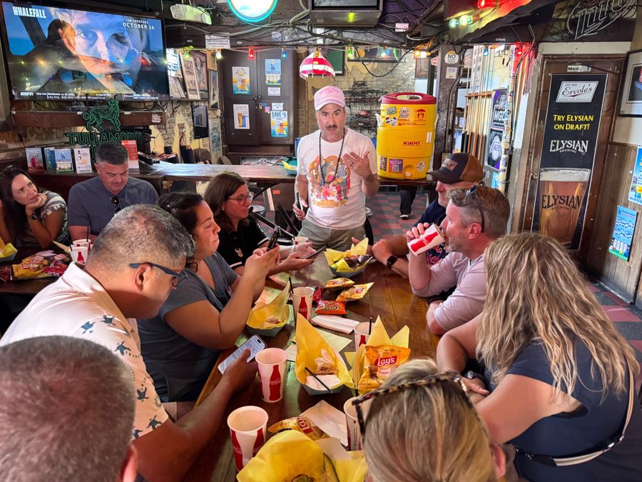 Brian telling stories to guests around a table at Ercole's