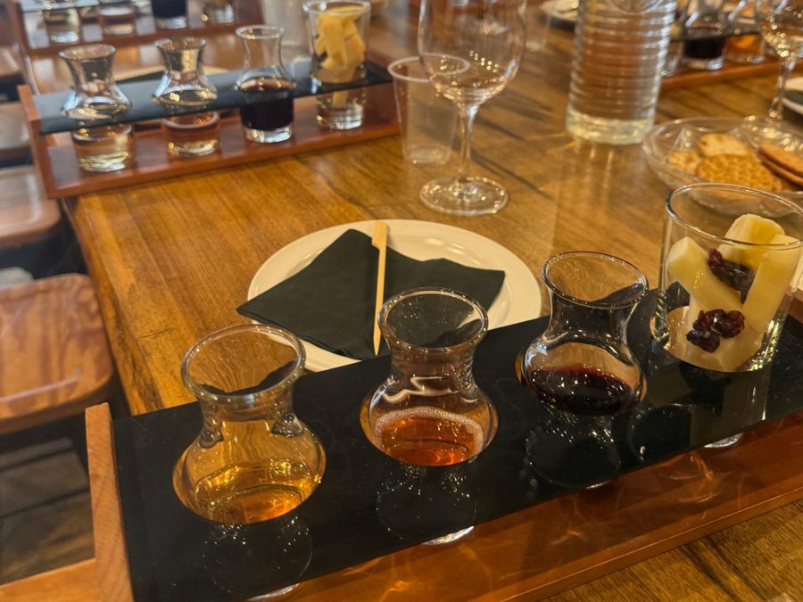A tasting flight with cheese and dried fruit