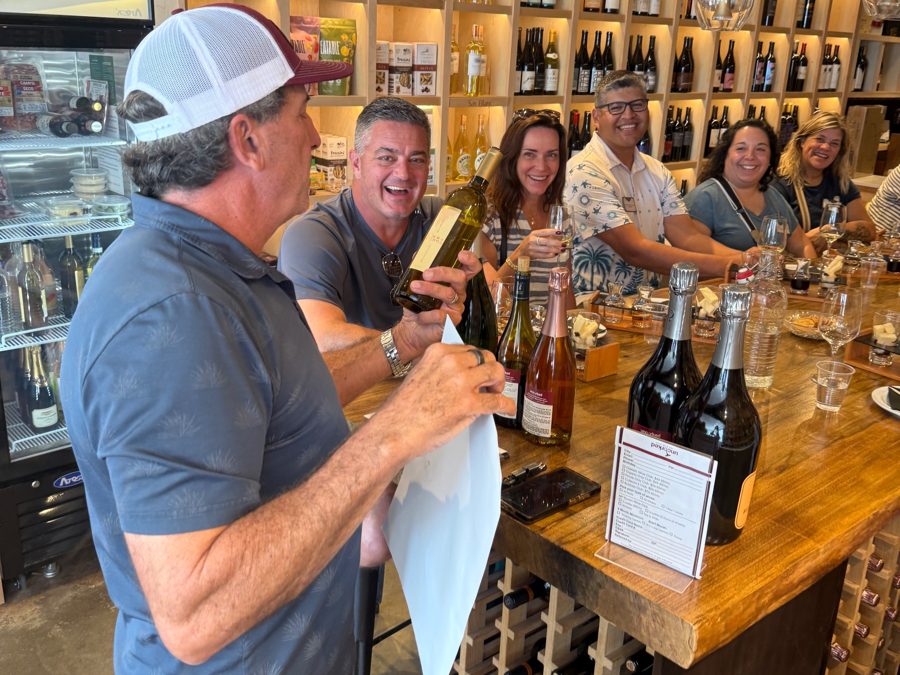 Guests laughing during a wine tasting